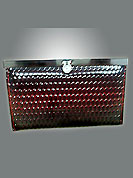 Shimmer rexin made maroon clutch is trendy and stylish. Dot embossed pattern of this clutch is nice and gunmetal kisslock frame. Its is handy to carry and casual purpose clutch. Slight Color variations are possible due to differing screen and photograph resolutions.