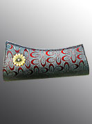 Ultimate grey clutch purse nicely designed with red oval shape pattern with golden flower brooch. Its cool and gives a modern look. This purse used in parties. Slight Color variations are possible due to differing screen and photograph resolutions.