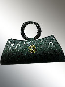 Classic rexin made clutch purse has oval shape print work with metal brooch. Handle covered with rexin. It is handy to carry and impress to all in everywhere. This purse used in parties. Slight Color variations are possible due to differing screen and photograph resolutions.