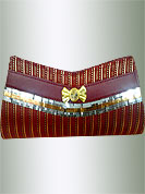 Classic rexin made clutch purse has strips work with stone brooch and metal chain. It is handy to carry and impress to all in everywhere. This purse used in parties. Slight Color variations are possible due to differing screen and photograph resolutions.
