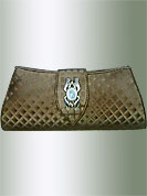 Delicate golden brown Clutch purse has self printed work with metal brooch on shield shape flap. It is handy to carry and impress to all in everywhere. This purse used in casual, formals and parties. Slight Color variations are possible due to differing screen and photograph resolution.