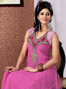 Be ready to slip in the comfort zone of this pink anarkali suit. This pretty Kameez is embellished with stylish velvet patch pattern on neckline done with sequins, cutdana, stone and diamond work. Velvet patch border on kameez make attractive to impress all. Stylish neck pattern is stunning and gives a pretty look. Matching dupatta and churidar is available. This drape material is net with inner. The entire ensemble makes an excellent wear. Slight Color variations are possible due to differing screen and photograph resolutions.