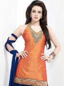 Be ready to slip in the comfort zone of this embroidered suit. The simple and sober orange and navy blue silk patiala salwar kameez is nicely designed with patch work on neckline and border. Embroidery is done with sequins, zari, kasab and cutdana work. Contrasting blue faux georgette patiala salwar and net dupatta is available with this suit. The entire ensemble makes an excellent wear. Slight Color variations are possible due to differing screen and photograph resolutions.