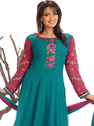 Motivate your look with this turquoise and pink suit. This amazing suit adorns with embroidery patch work on neckline and bottom area done with bandhej print, resham and zari work. Stylish neck pattern is stunning. This suit is made with silk fabric. Contrasting pink cotton silk churidar and faux chiffon dupatta is available with this. Slight Color variations are possible due to differing screen and photograph resolutions.