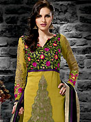 Ultimate collection of embroidered suits with fabulous style. The dazzling golden yellow georgette churidar suit have amazing embroidery and patch work. Embroidery is done with resham and zari work in form of floral motifs. Embroidery on kameez is highlighting the beauty of this suit. Beautiful embroidery work on kameez is stunning. Contrasting magenta churidar and black dupatta come along with this suit. Accessories shown in the image is just for photography purpose. Slight Color variations are possible due to differing screen and photograph resolutions.