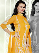 Emblem of fashion and beauty, each piece of our range of embroidered suit is certain to enhance your look as per today’s trends. This golden yellow georgette kameez has beautiful embroidered and patch work. Embroidery is done with resham and zari work in form of floral motifs. Embroidery on kameez is highlighting the beauty of this suit. Matching santoon churidar and chiffon dupatta is available with this suit. It’s a wonderful party wear suit. Slight color variations are possible due to differing screen and photograph resolutions.