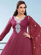 The fascinating beautiful subtly garment with lovely patterns. The dazzling burgundy faux georgette churidar suit have amazing embroidery patch work is done with resham, zari and sequins work. Beautiful embroidery work on kameez is stunning. The entire ensemble makes an excellent wear. Matching santoon churidar and dupatta is available with this suit. Slight Color variations are possible due to differing screen and photograph resolutions.