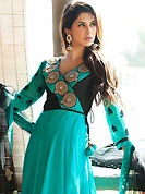 It is color this season and bright shaded suits are really something that is totally in vogue. The dazzling sky blue faux georgette readymade churidar suit have amazing embroidery patch work is done with applique and beads work. Beautiful embroidery work on kameez is stunning. The entire ensemble makes an excellent wear. Matching churidar and shaded net dupatta is available with this suit. Slight Color variations are possible due to differing screen and photograph resolutions.