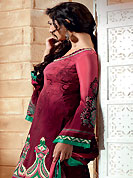 The most beautiful refinements for style and tradition. The dazzling dark pink and maroon crepe churidar suit have amazing abstract print and embroidery patch work is done with resham and applique work. The entire ensemble makes an excellent wear. Matching maroon churidar and printed dupatta is available with this suit. Slight Color variations are possible due to differing screen and photograph resolutions.