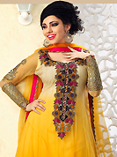 An occasion wear perfect is ready to rock you. The dazzling shaded yellow net readymade anarkali churidar suit have amazing embroidery patch work is done with resham, zari, stone and lace work. Beautiful embroidery work on kameez is stunning. The entire ensemble makes an excellent wear. Matching churidar and dupatta is available with this suit. Slight Color variations are possible due to differing screen and photograph resolutions.