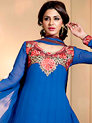 Get ready to sizzle all around you by sparkling suit. The dazzling blue chiffon churidar suit have amazing embroidery patch work is done with resham, zari and stone work. Beautiful embroidery work on kameez is stunning. The entire ensemble makes an excellent wear. Matching santoon churidar and chiffon dupatta is available with this suit. Slight Color variations are possible due to differing screen and photograph resolutions.