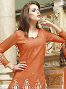 Let your personality articulate for you with this amazing embroidered suit. The dazzling rust cotton salwar kameez have amazing embroidery patch work is done with resham, zari, stone and lace work. The entire ensemble makes an excellent wear. Matching salwar and chiffon dupatta is available with this suit. Slight Color variations are possible due to differing screen and photograph resolutions.