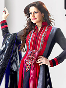 Breathtaking collection of suits with stylish embroidery work and fabulous style. The dazzling dark grey and red satin anarkali churidar suit have amazing embroidery patch work is done with resham and sequins work. Beautiful embroidery work on kameez is stunning. The entire ensemble makes an excellent wear. Contrasting black santoon churidar and shaded grey dupatta is available with this suit. Slight Color variations are possible due to differing screen and photograph resolutions.