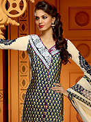 Your search for elegant look ends here with this lovely suit. The dazzling dark navy blue and buttercream faux crepe churidar suit have amazing embroidery patch work is done with resham, zari, stone and mirror work. The entire ensemble makes an excellent wear. Matching dark navy blue churidar and buttercream dupatta is available with this suit. Slight Color variations are possible due to differing screen and photograph resolutions.