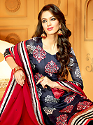 The glamorous silhouette to meet your most dire fashion needs. The dazzling dark navy blue faux crepe churidar suit have amazing embroidery patch work is done with resham, zari and stone work. The entire ensemble makes an excellent wear. Matching churidar and red dupatta is available with this suit. Slight Color variations are possible due to differing screen and photograph resolutions.