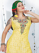 Attract all attentions with this embroidered suit. The dazzling yellow art silk readymade salwar kameez have amazing embroidery patch work is done with resham, sequins, stone, cutdana and kasab work. Beautiful embroidery work on kameez is stunning. The entire ensemble makes an excellent wear. Contrasting red salwar and green dupatta is available with this suit. Slight Color variations are possible due to differing screen and photograph resolutions.
