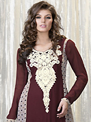 Attract all attentions with this embroidered suit. The dazzling brown and off white faux georgette churidar suit have amazing dots print and embroidery patch work is done with resham, stone and lace work. Beautiful embroidery work on kameez is stunning. The entire ensemble makes an excellent wear. Matching santoon churidar and chiffon dupatta is available with this suit. Slight Color variations are possible due to differing screen and photograph resolutions.