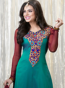Get ready to sizzle all around you by sparkling suit. The dazzling teal green faux georgette churidar suit have amazing embroidery patch work is done with resham, zari and stone work. Beautiful embroidery work on kameez is stunning. The entire ensemble makes an excellent wear. Contrasting maroon santoon churidar and maroon chiffon dupatta is available with this suit. Slight Color variations are possible due to differing screen and photograph resolutions.