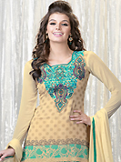 Attract all attentions with this embroidered suit. The dazzling buttercream faux georgette churidar suit have amazing embroidery patch work is done with resham, stone and lace work. Beautiful embroidery work on kameez is stunning. The entire ensemble makes an excellent wear. Matching santoon churidar and chiffon dupatta is available with this suit. Slight Color variations are possible due to differing screen and photograph resolutions.