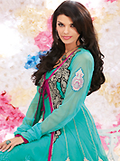 The glamorous silhouette to meet your most dire fashion needs. The dazzling sea green georgette and net churidar suit have amazing embroidery patch work is done with resham, zari, sequins, stone and lace work. Beautiful embroidery work on kameez is stunning. The entire ensemble makes an excellent wear. Matching santoon churidar and chiffon dupatta is available with this suit. Slight Color variations are possible due to differing screen and photograph resolutions.