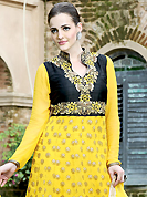 Get ready to sizzle all around you by sparkling suit. The dazzling yellow and shaded black georgette anarkali churidar suit have amazing embroidery patch work is done with resham and zari work. Beautiful embroidery work on kameez is stunning. The entire ensemble makes an excellent wear. Matching churidar and dupatta is available with this suit. Slight Color variations are possible due to differing screen and photograph resolutions.