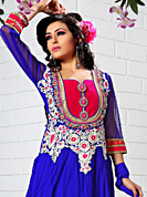 It is color this season and bright shaded suits are really something that is totally in vogue. The dazzling royal blue net anarkali churidar suit have amazing embroidery and velvet patch work is done with resham, gold zardosi, cutdana and stone work. Beautiful embroidery work on kameez is stunning. The entire ensemble makes an excellent wear. Matching santoon churidar and net dupatta is available with this suit. Slight Color variations are possible due to differing screen and photograph resolutions.