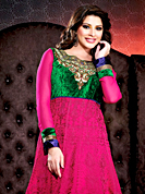 Take a look on the changing fashion of the season. The dazzling deep pink georgette long style anarkali churidar suit have amazing embroidery and velvet patch work is done with resham, zari, stone and lace work. Beautiful embroidery work on kameez is stunning. The entire ensemble makes an excellent wear. Contrasting green santoon churidar and shaded chiffon dupatta is available with this suit. Slight Color variations are possible due to differing screen and photograph resolutions.