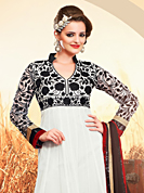 Outfit is a novel ways of getting yourself noticed. The dazzling off white georgette anarkali churidar suit have amazing embroidery patch work is done with resham, sequins and lace work. Beautiful embroidery work on kameez is stunning. The entire ensemble makes an excellent wear. Contrasting black santoon churidar and black chiffon dupatta is available with this suit. Slight Color variations are possible due to differing screen and photograph resolutions.