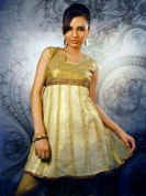 This golden kurti with net and simar lining will give an extraordinary glow to your beauty.
It has an astonishing neck and shoulder line with artistically created strands from mid to bottom of the kurti.
The kurti is suitable for all occasions.
It has a classy brown shaded border at the center and at the base.