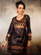 Get into the bold and beautiful look with this dashing black cotton silk kurti.
It has a stylish brocket patch in the centre which makes it look terrific for all kind of occasions.
The lace work done on the wrist and the base with the shades of maroon and golden looks amazing on the kurti and completes the trendy look.