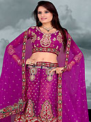 Make your collection more attractive and charming with this impressive dress. This dark magenta lehenga choli is nicely embroidered and patch work done with  resham, zari, sequins and stone work in form of floral motifs. All over embroidery work on lehenga is stunning. The beautiful embroidery on lehenga made it awesome and gives you stylish and attractive look to others. Matching and dupatta is availble with this lehenga. Slight Color variations are possible due to differing screen and photograph resolutions.
