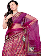 Today’s fashion is really about sensuality which can be seen in this creation. This burgundy net and dupion silk A-Line lehenga choli is nicely embroidered and patch work done with resham, zari, kasab and sequins work in form of floral motifs. Beautiful embroidery work on lehenga is stunning. The beautiful embroidery on lehenga made it awesome and gives you stylish and attractive look to others. Matching choli and dupatta is availble with this lehenga. Slight Color variations are possible due to differing screen and photograph resolutions.