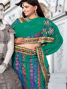 Today’s fashion is really about sensuality which can be seen in this creation. This turquoise green net and brocade lehenga choli is nicely embroidered and patch work done with resham, sequins and lace work in form of floral motifs. The beautiful embroidery on lehenga made it awesome and gives you stylish and attractive look to others. Matching choli and dupatta is availble with this lehenga. Slight Color variations are possible due to differing screen and photograph resolutions.