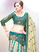 Today’s fashion is really about sensuality which can be seen in this creation. This light fawn and teal green faux georgette lehenga choli is nicely embroidered and velvet patch border is done with resham, zari, stone and sequins work. The beautiful embroidery on lehenga made it awesome and gives you stylish and attractive look to others. Matching choli and double dye dupatta is availble with this lehenga. Slight Color variations are possible due to differing screen and photograph resolutions.