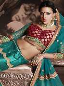 It’s cool and has a very modern look to impress all. This turquoise green net lehenga is nicely embroidered patch work is done with resham, zari, sequins, stone and lace work. The beautiful embroidery on lehenga made it awesome and gives you stylish and attractive look to others. Contrasting maroon and turquoise green choli and turquoise green net dupatta is availble with this lehenga. Slight Color variations are possible due to differing screen and photograph resolutions.