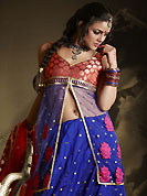 Embroidered lehengas are highly in order on a range of occasions such as wedding, formal party and festivals. This dark blue lehenga is nicely embroidered patch work is done with resham, zari, sequins, stone and lace work. The beautiful embroidery on lehenga made it awesome and gives you stylish and attractive look to others. Contrasting dark red and blue long choli and dark red net dupatta is availble with this lehenga. Slight Color variations are possible due to differing screen and photograph resolutions.