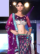 Elegance and innovation of designs crafted for you. This dark grey and dark purple net lehenga is nicely embroidered patch work is done with resham, zari, sequins, stone and lace work. The beautiful embroidery on lehenga made it awesome and gives you stylish and attractive look to others. Matching choli and dupatta is availble with this lehenga. Slight Color variations are possible due to differing screen and photograph resolutions.