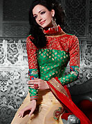 The traditional patterns used on this lehenga maintain the ethnic look. This light fawn net a-line lehenga choli is nicely embroidered patch border is done with resham, zari, stone and lace work. The beautiful embroidery on lehenga made it awesome and gives you stylish and attractive look to others. Contrasting green and red brocade choli and red net dupatta is availble with this lehenga. Slight Color variations are possible due to differing screen and photograph resolutions.