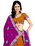 Get ready to sizzle all around you by sparkling lehenga. This rust faux georgette lehenga is nicely embroidered patch work is done with resham, zari, sequins and stone work. The beautiful embroidery on lehenga made it awesome and gives you stylish and attractive look to others. Matching choli and purple dupatta is availble with this lehenga. Slight Color variations are possible due to differing screen and photograph resolutions.