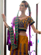 Embroidered lehengas are the best choice for a girl to enhance her feminine look. This rust net a-line lehenga choli is nicely embroidered patch border is done with resham, zari, sequins, stone and lace work. The beautiful embroidery on lehenga made it awesome and gives you stylish and attractive look to others. Matching choli and purple net dupatta is availble with this lehenga. Slight Color variations are possible due to differing screen and photograph resolutions.