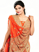No one like ordinary look, because every woman has their own beauty and our collection gives extra ordinary look to you. This dark orange georgette lehenga is nicely embroidered patch work is done with zari, cutdana, sequins, stone and cutbeads work. The beautiful embroidery on lehenga made it awesome and gives you stylish and attractive look to others. Matching choli and dupatta is availble with this lehenga. Slight Color variations are possible due to differing screen and photograph resolutions.