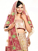 Today’s fashion is really about sensuality which can be seen in this creation. This peach and pink net lehenga is nicely embroidered patch work is done with zardosi, stone, cutdana, beads and cutbeads work. The beautiful embroidery on lehenga made it awesome and gives you stylish and attractive look to others. Matching peach choli and shaded net dupatta is availble with this lehenga. Slight Color variations are possible due to differing screen and photograph resolutions.
