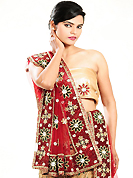 Make your collection more attractive and charming with this impressive dress. This fawn net lehenga is nicely embroidered and velvet patch work is done with cutdana, sequins, stone, beads and cutbeads work. The beautiful embroidery on lehenga made it awesome and gives you stylish and attractive look to others. Matching choli and red net dupatta is availble with this lehenga. Slight Color variations are possible due to differing screen and photograph resolutions.