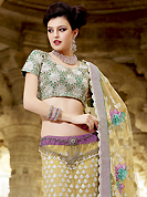 Outfit is a novel ways of getting yourself noticed. This light yellow and light purple net lehenga choli is nicely embroidered patch work is done with resham, zari, sequins, stone and lace work. All over embroidery work on lehenga is stunning. The beautiful heavy embroidery on lehenga made it awesome and gives you stylish and attractive look to others. Contrasting turquoise green choli and light yellow net dupatta is availble with this lehenga. Accessories shown in the image is just for photography purpose. Slight Color variations are possible due to differing screen and photograph resolutions.