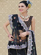 Today’s fashion is really about sensuality which can be seen in this creation. This black net a-line lehenga is nicely embroidered patch work is done with resham, zari, sequins and stone work. The beautiful embroidery on lehenga made it awesome and gives you stylish and attractive look to others. Matching choli and dupatta is availble with this lehenga. Slight Color variations are possible due to differing screen and photograph resolutions.