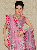 No one like ordinary look, because every woman has their own beauty and our collection gives extra ordinary look to you. This pink net a-line lehenga is nicely embroidered and velvet patch work is done with zari, sequins, stone, beads and cutbeads work. The beautiful embroidery on lehenga made it awesome and gives you stylish and attractive look to others. Matching choli and dupatta is availble with this lehenga. Slight Color variations are possible due to differing screen and photograph resolutions.