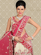 Welcome to the new era of Indian fashion wear. This off white net a-line lehenga is nicely embroidered and velvet patch work is done with zardosi, stone and cutbeads work. The beautiful embroidery on lehenga made it awesome and gives you stylish and attractive look to others. Matching choli and pink dupatta is availble with this lehenga. Slight Color variations are possible due to differing screen and photograph resolutions.