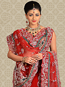 Outfit is a novel ways of getting yourself noticed. This red velvet a-line lehenga is nicely embroidered and velvet patch work is done with zardosi, stone and cutbeads work. The beautiful embroidery on lehenga made it awesome and gives you stylish and attractive look to others. Matching choli and dupatta is availble with this lehenga. Slight Color variations are possible due to differing screen and photograph resolutions.