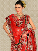 Take a look on the changing fashion of the season. This red net a-line lehenga is nicely embroidered and velvet patch work is done with zari, stone and cutbeads work. The beautiful embroidery on lehenga made it awesome and gives you stylish and attractive look to others. Matching choli and dupatta is availble with this lehenga. Slight Color variations are possible due to differing screen and photograph resolutions.