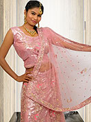 Its cool and have a very modern look to impress all. A Lehenga made with  Net fabric. This lehenga embellished with stone, sitara, zarkins, and resham work. The beautiful heavy embroidery made it awesome and gives you stylish and attractive look to others. The matching blouse and chunari are enhanced your personality. Slight Color variations possible due to differing screen and photograph resolutions.